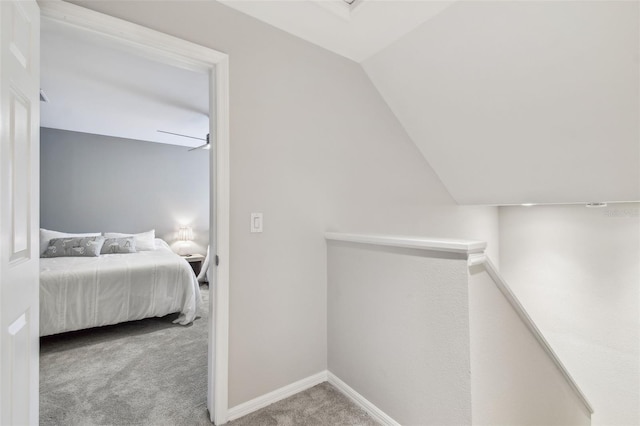 carpeted bedroom featuring lofted ceiling