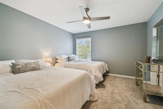 bedroom with light colored carpet and ceiling fan