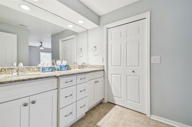 bathroom featuring ceiling fan and vanity