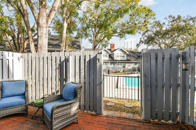 view of gate featuring a fenced in pool