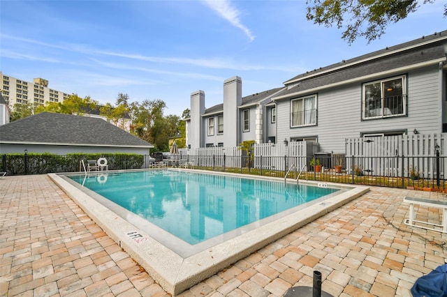 view of swimming pool featuring a patio area