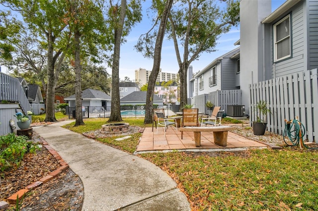 view of yard with a patio area and central air condition unit