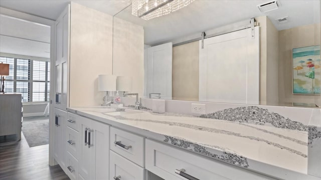 bathroom featuring hardwood / wood-style flooring and vanity