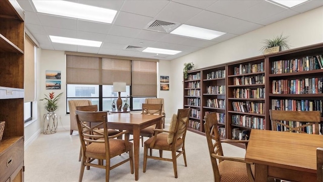 dining room with a paneled ceiling