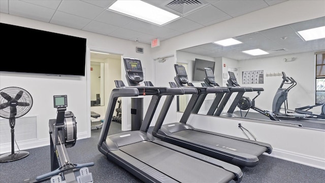 workout area with a drop ceiling