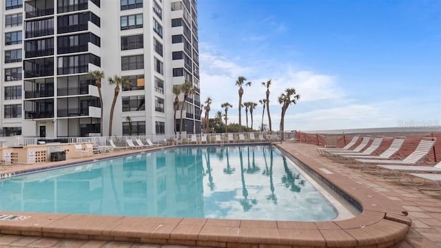 view of pool featuring a patio