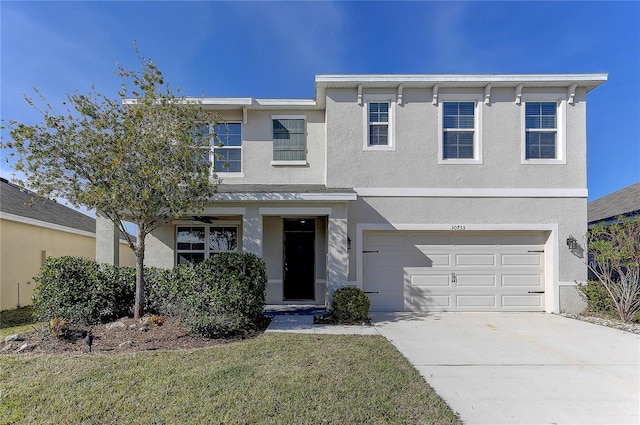 view of front of property featuring a garage and a front yard