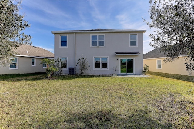 back of property with a yard and cooling unit