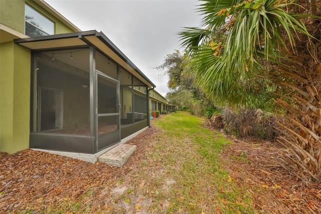 view of yard with a sunroom