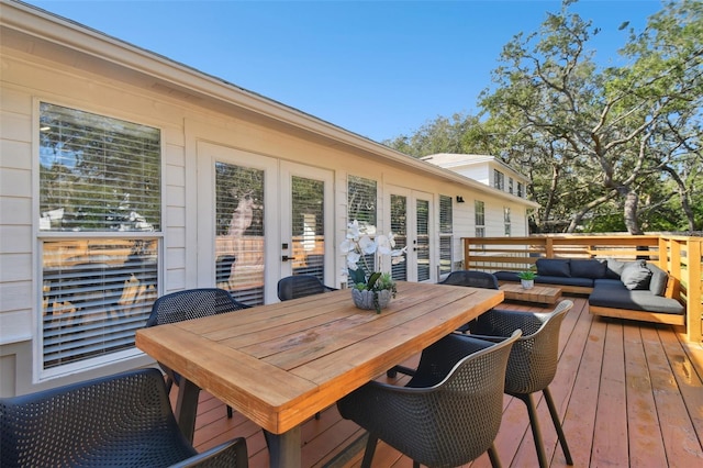 wooden deck with an outdoor living space