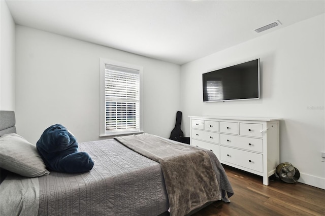 bedroom featuring dark hardwood / wood-style floors