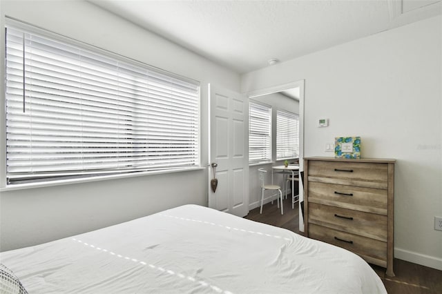 bedroom featuring dark wood-type flooring