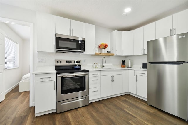 kitchen featuring white cabinetry, appliances with stainless steel finishes, and sink