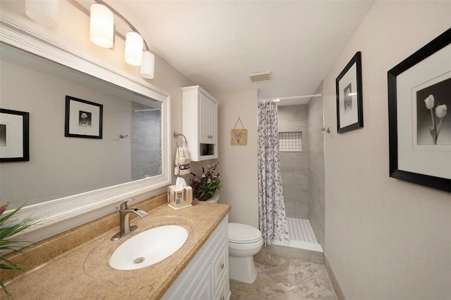 bathroom with vanity, toilet, and a shower with shower curtain