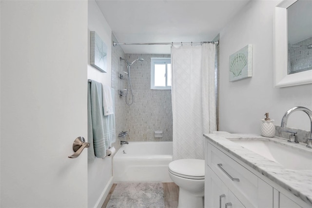 full bathroom featuring vanity, shower / tub combo, and toilet