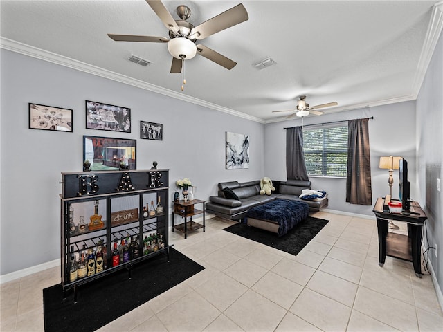 living room with ornamental molding, light tile patterned floors, and ceiling fan