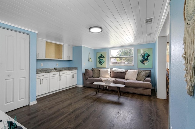 living room with wood ceiling, ornamental molding, and dark hardwood / wood-style flooring