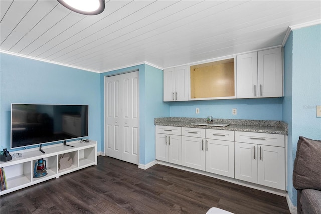 kitchen featuring wood ceiling, ornamental molding, dark hardwood / wood-style flooring, and white cabinets