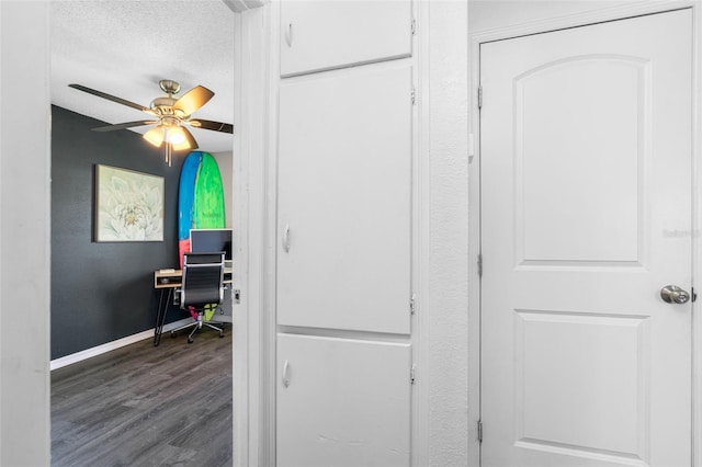 interior space with wood-type flooring and ceiling fan