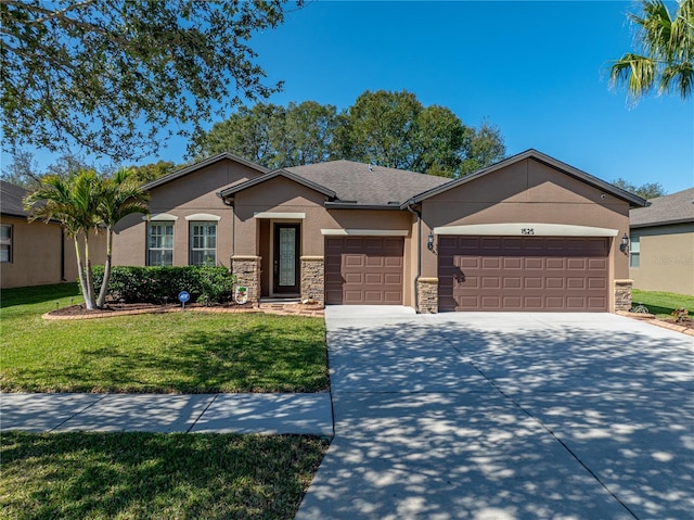 single story home featuring a garage and a front yard