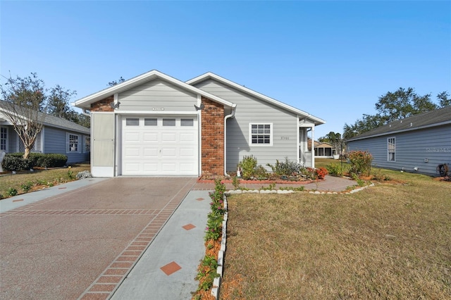 ranch-style house with a garage and a front lawn