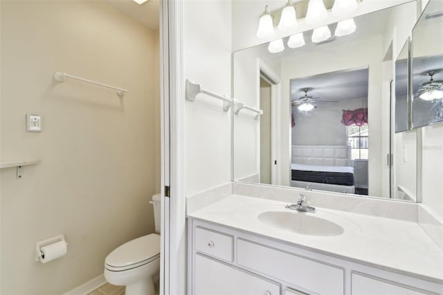 bathroom with vanity, ceiling fan, and toilet