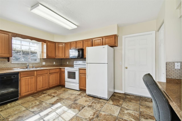 kitchen featuring sink, backsplash, and black appliances