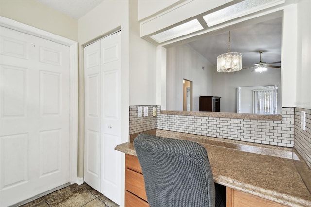 interior space featuring ceiling fan