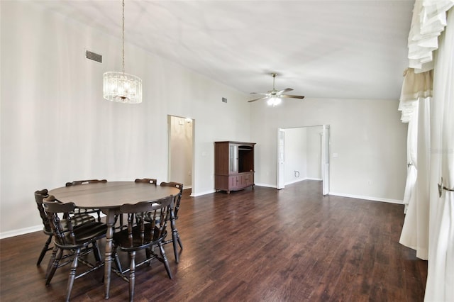 dining space with ceiling fan, lofted ceiling, and dark hardwood / wood-style flooring