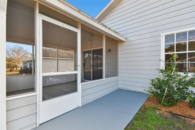 property entrance featuring a patio