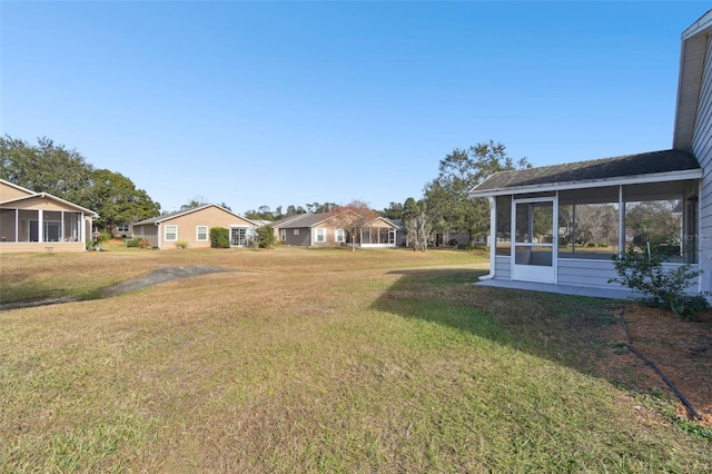 view of yard with a sunroom