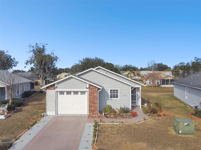 view of front of house featuring a garage and a front lawn