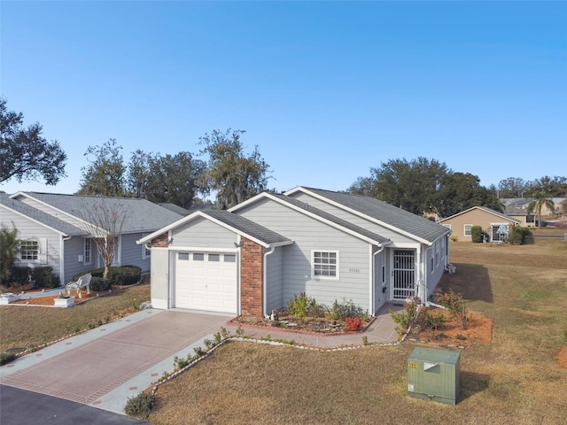 single story home with a garage and a front yard