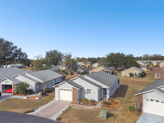 view of front of home featuring a garage and a front lawn