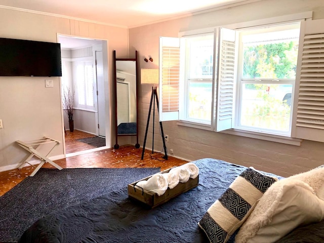 bedroom featuring ornamental molding and parquet flooring