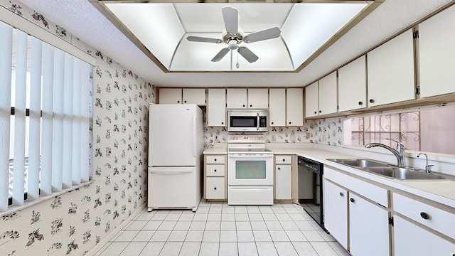 kitchen featuring ceiling fan, white appliances, sink, and white cabinets