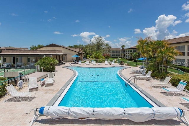 view of swimming pool featuring a patio area