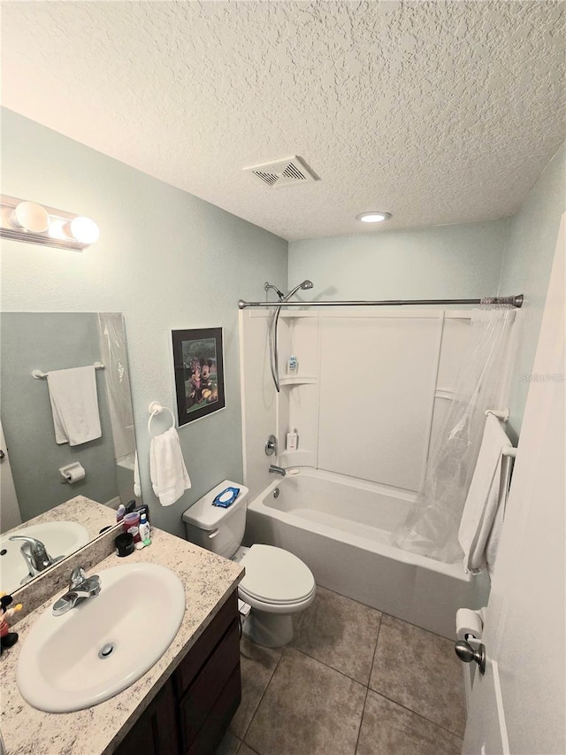 bathroom featuring a textured ceiling, tile patterned flooring, vanity, visible vents, and shower / bath combo