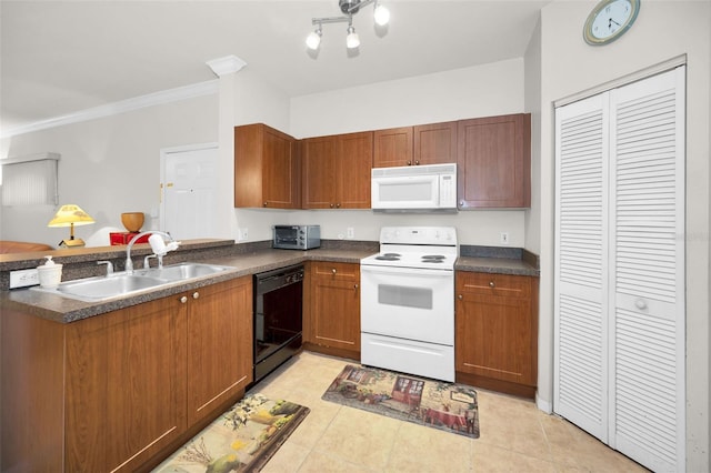 kitchen featuring sink, white appliances, kitchen peninsula, and light tile patterned flooring