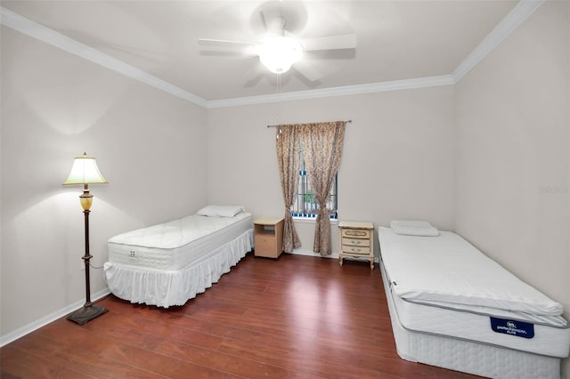 bedroom with crown molding, dark wood-type flooring, and ceiling fan