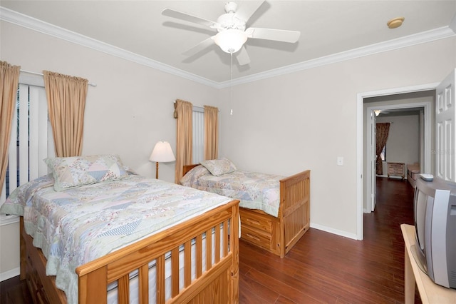 bedroom with crown molding, dark wood-type flooring, and ceiling fan