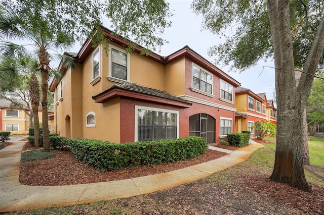 2254 Chianti Pl Unit 68, Palm Harbor, FL 34683 - view of front facade featuring stucco siding