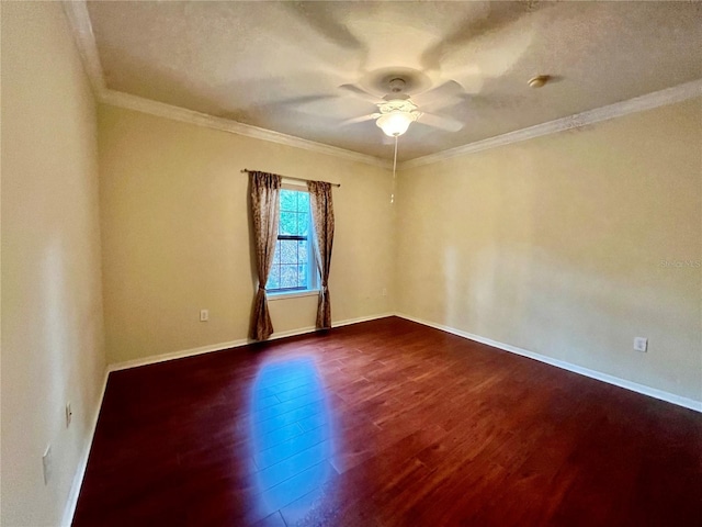 2254 Chianti Pl Unit 68, Palm Harbor, FL 34683 - empty room featuring dark wood-style flooring, ceiling fan, crown molding, and baseboards