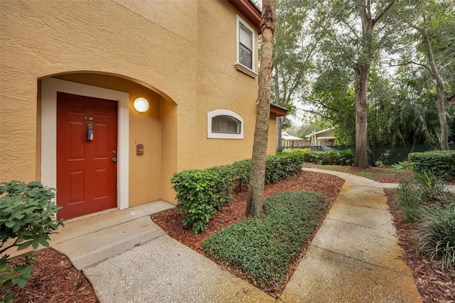 2254 Chianti Pl Unit 68, Palm Harbor, FL 34683 - doorway to property with stucco siding