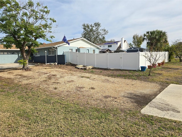 view of yard featuring a garage