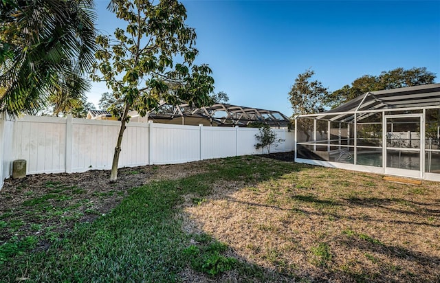 view of yard featuring a lanai