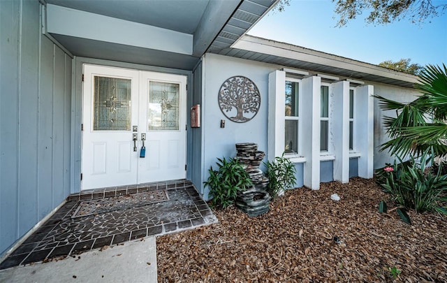 property entrance featuring french doors