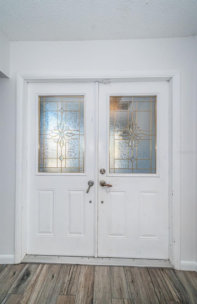 entrance to property featuring french doors