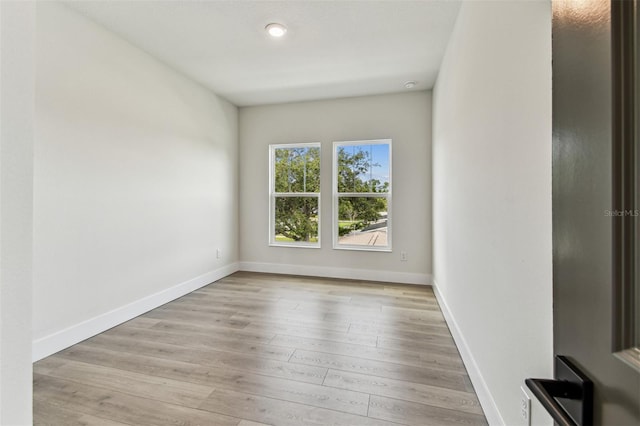 441 42nd Ave NE, Saint Petersburg, FL 33703 - spare room featuring wood finished floors and recessed lighting