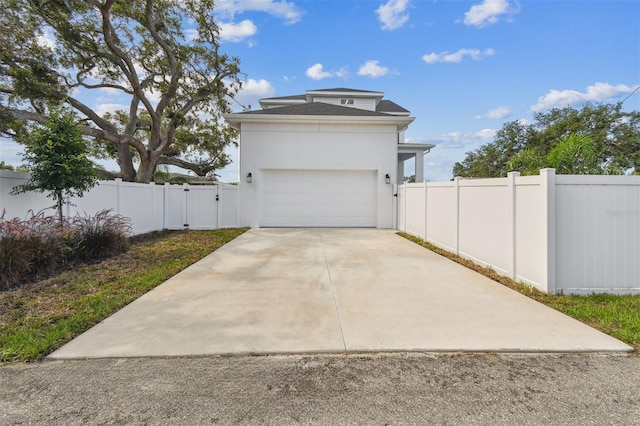 441 42nd Ave NE, Saint Petersburg, FL 33703 - garage featuring a gate and driveway
